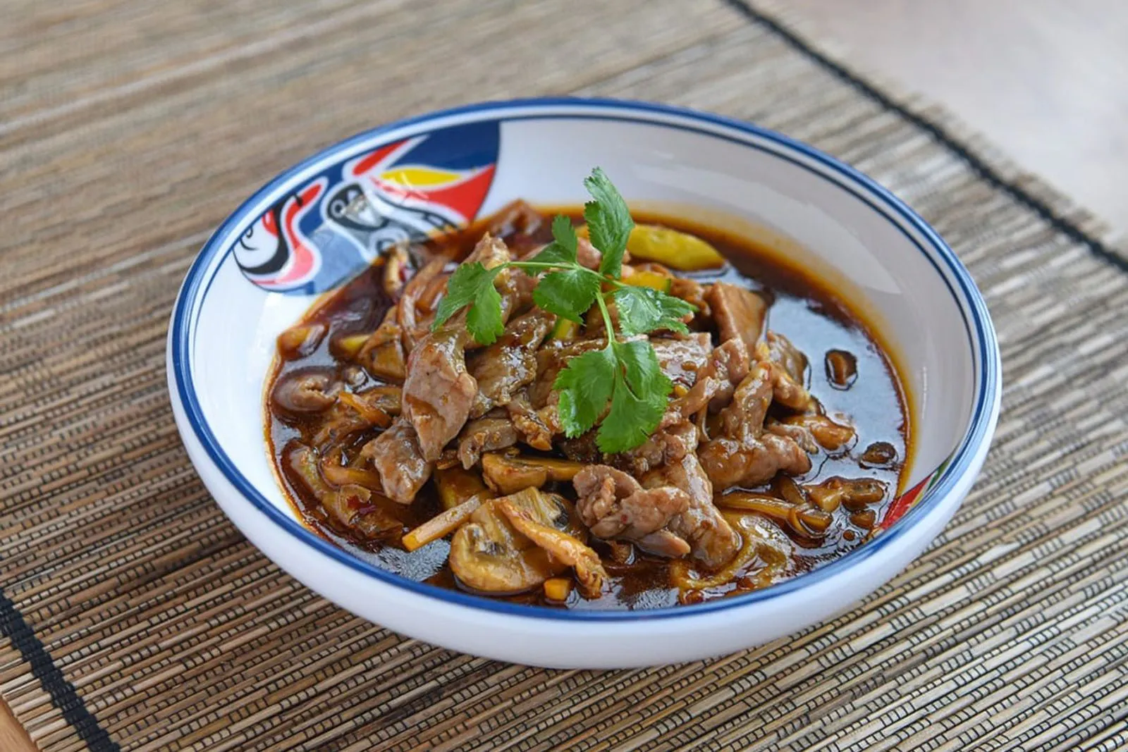 Spicy beef stir-fry with cilantro garnish at AYCE Bar & Wok, an Asian Fusion Restauran in Wind Gap