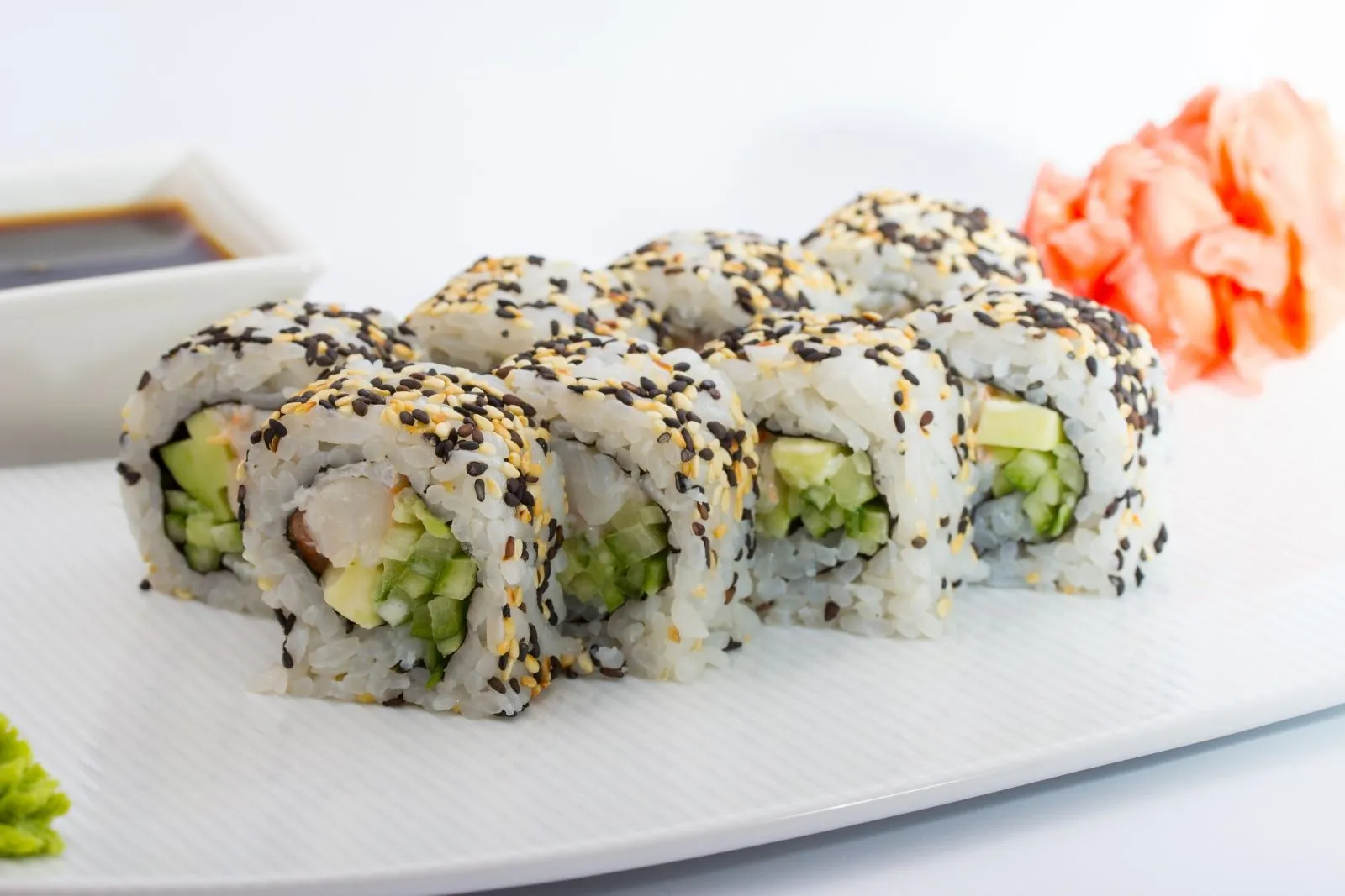 Vegetable sushi roll with sesame seeds, avocado and cucumber at AYCE Bar & Wok, an Asian Fusion Restauran in Wind Gap
